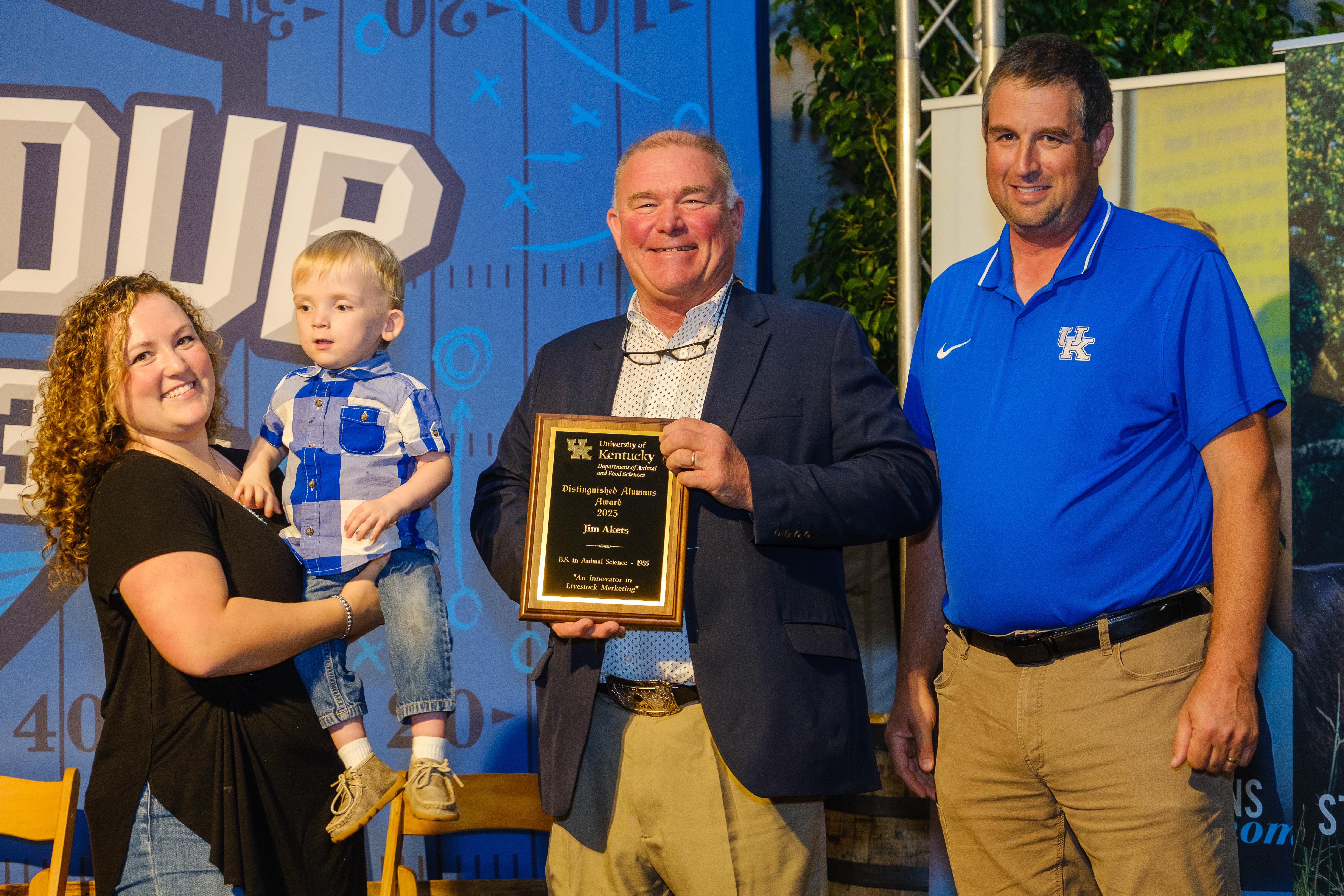 Dr. Radcliffe presents the Distinguished Alumnus award to Jim Akers