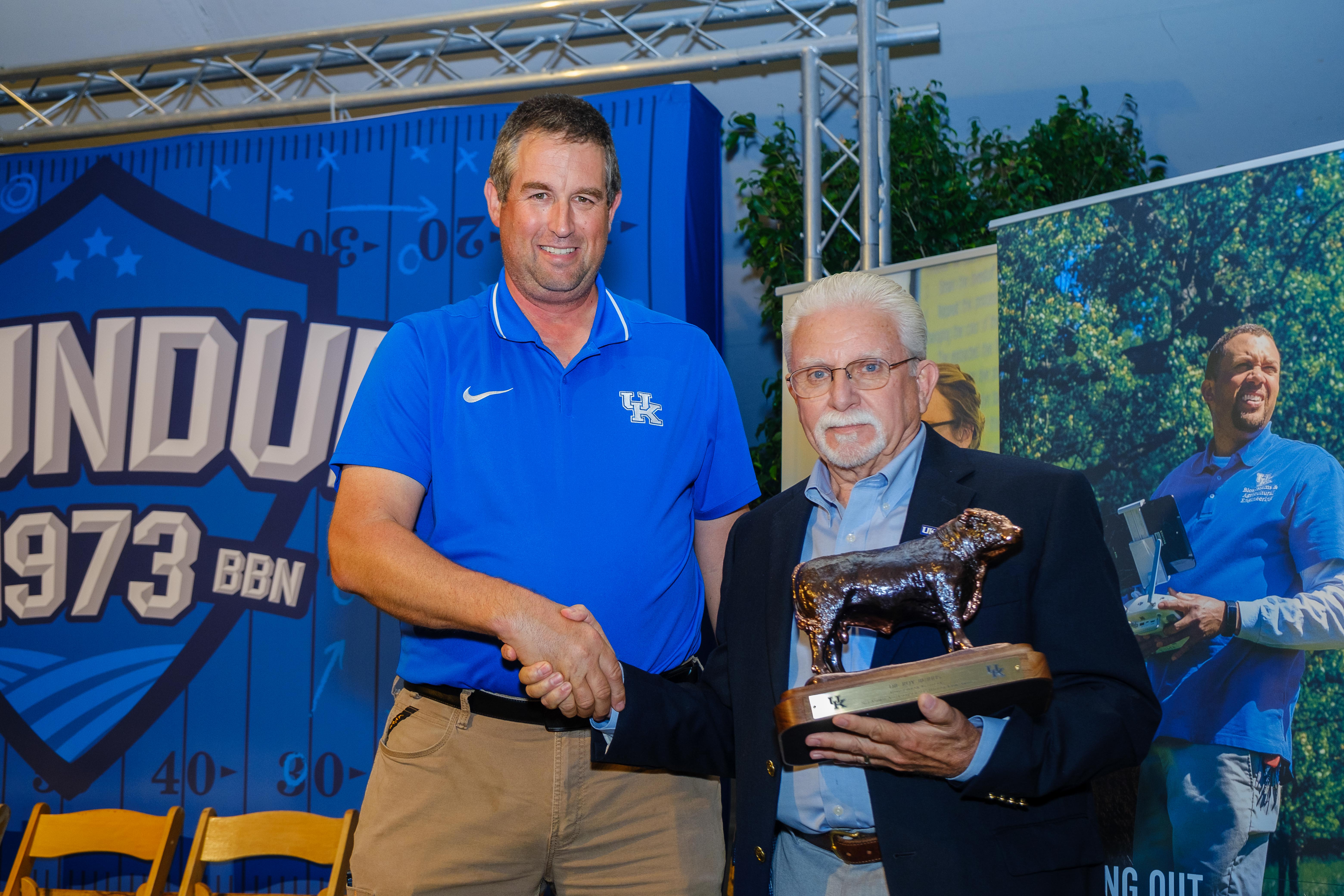 Dr. Radcliffe present Roy Burris the 2023 Hall of Fame Award