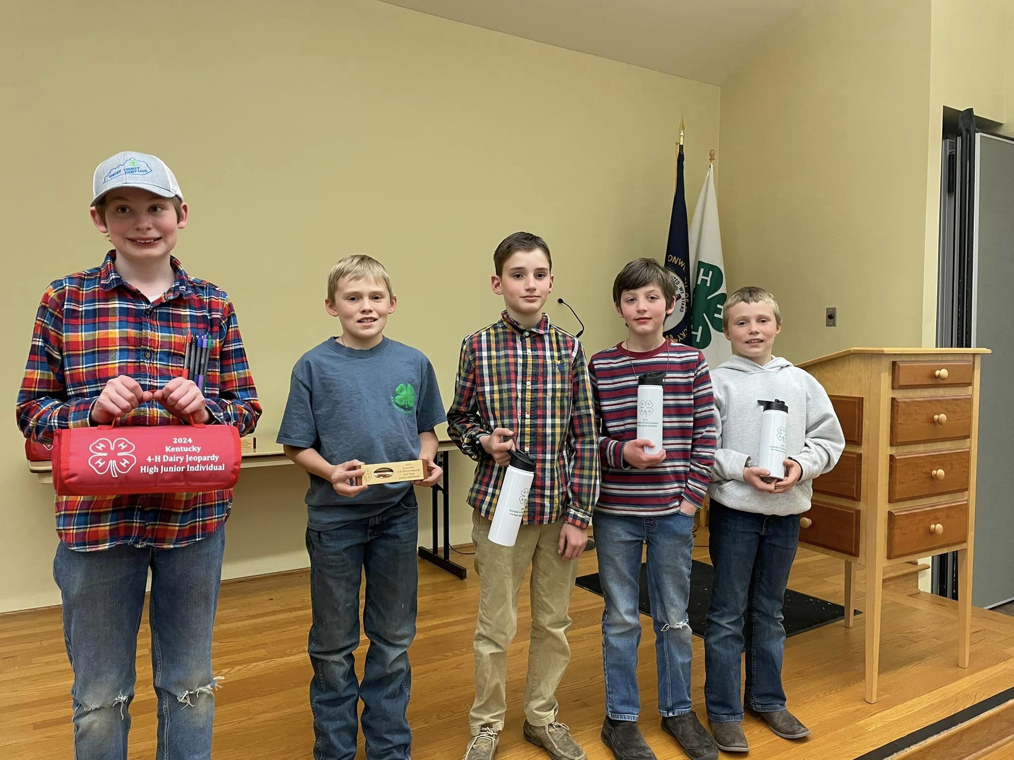 Boys holding prizes